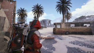 Arc Raiders new blueprints: A player looking at a Turbine enemy in the distance, between trees and a bus.