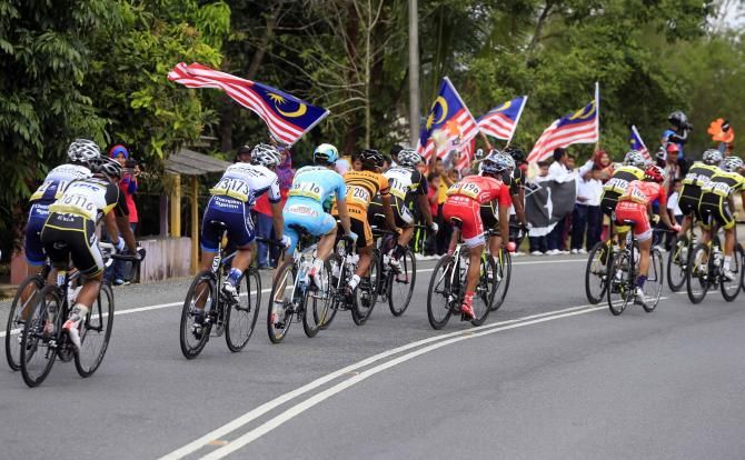 The Tour de Langkawi peloton speeds towards Marang.