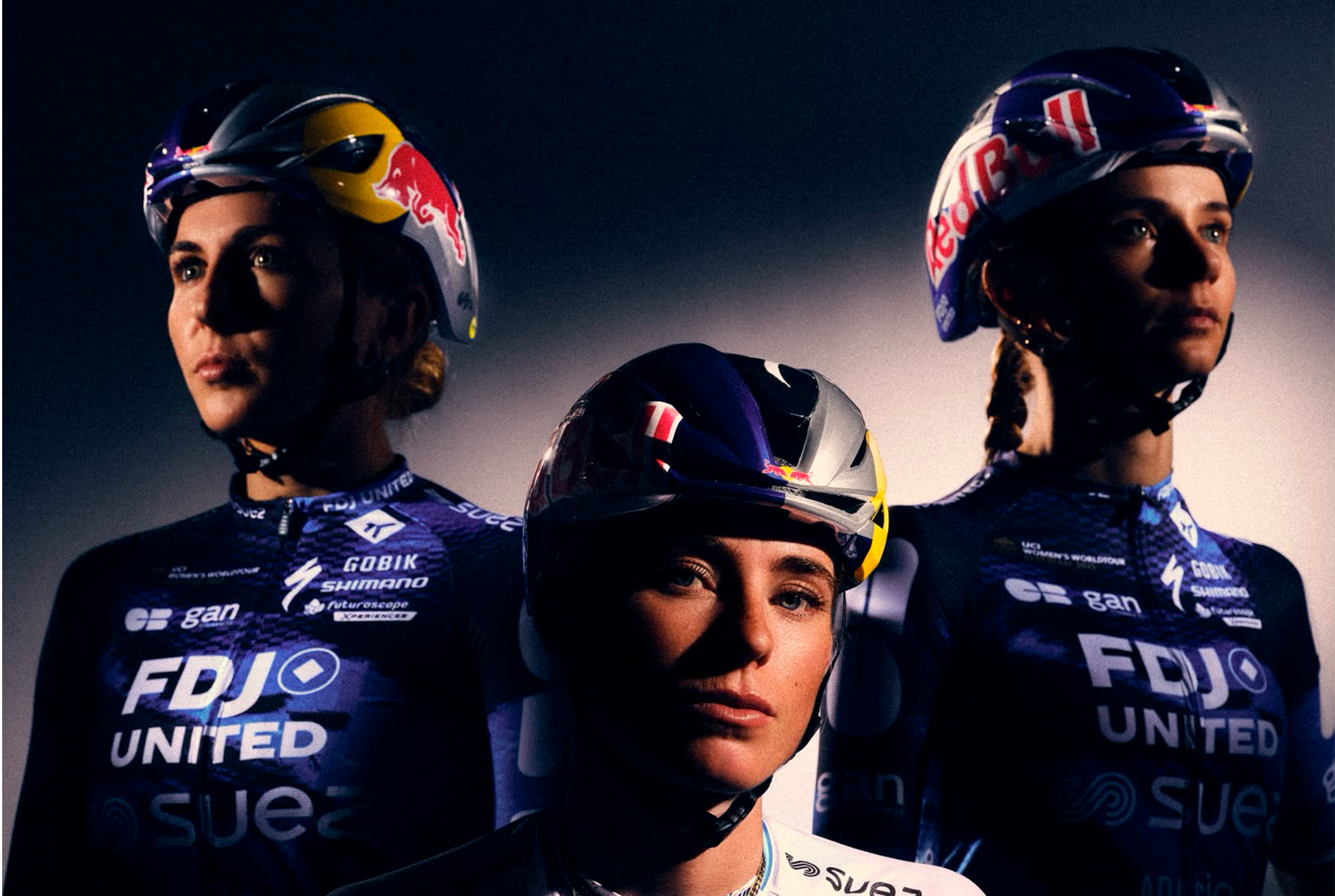 Three FDJ United-Suez riders in Red Bull helmets