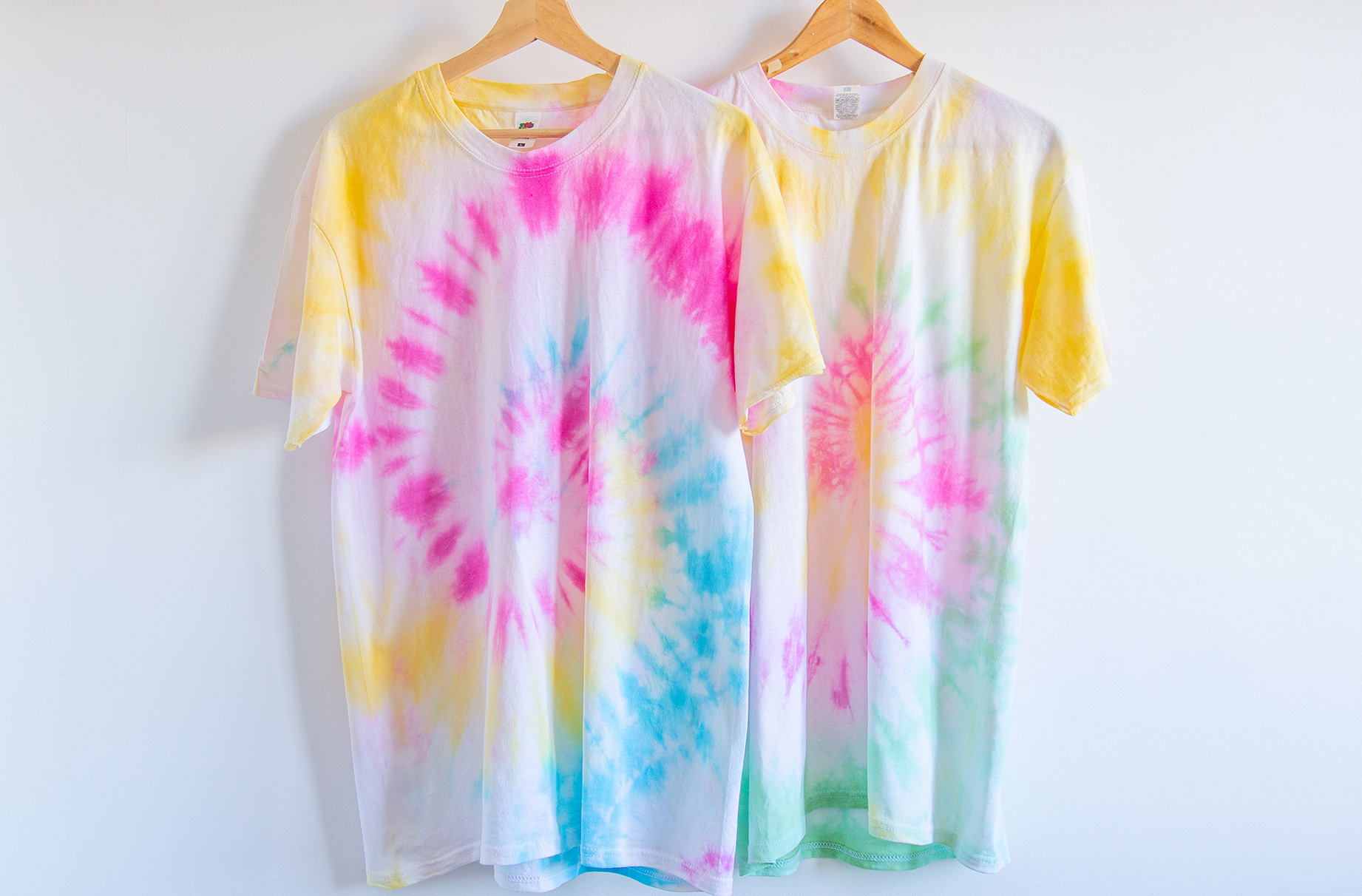 Homemade tie dye t-shirts with a spiral pattern.