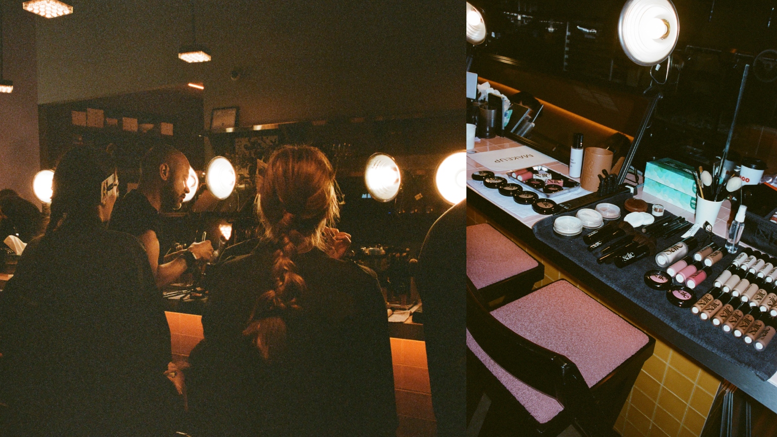 backstage at Kallmeyer, darkly lit room with models in black chairs getting their makeup done