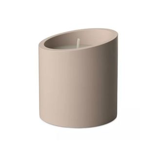 candle in minimalist stone vessel in nude color