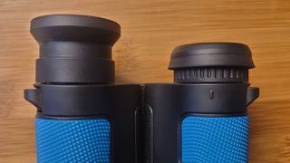 A close up of the Occer 12x25's eyecups, with one extended and one folded.
