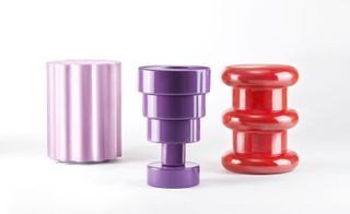 The complex plastic pieces include (left to right) the 'Colonna' stool, the 'Calice' vase and the 'Pilastro' stool