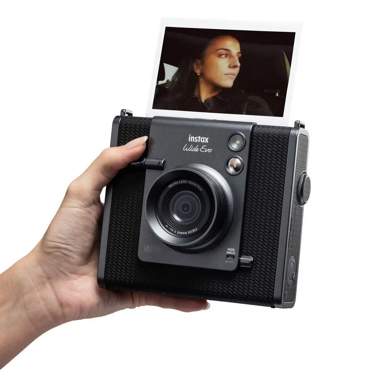 Fujifilm Instax Wide Evo camera with a photo printing out the top.