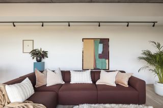 brown sofa and cream minimalism at living space of Vabel Lawrence Penthouse