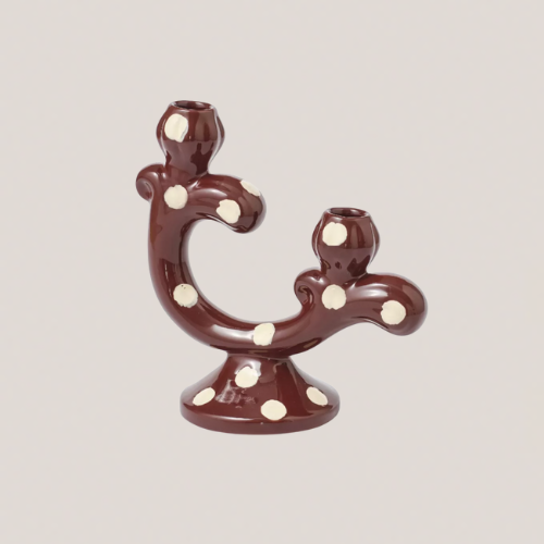 A burgundy candelabra with white polka dots