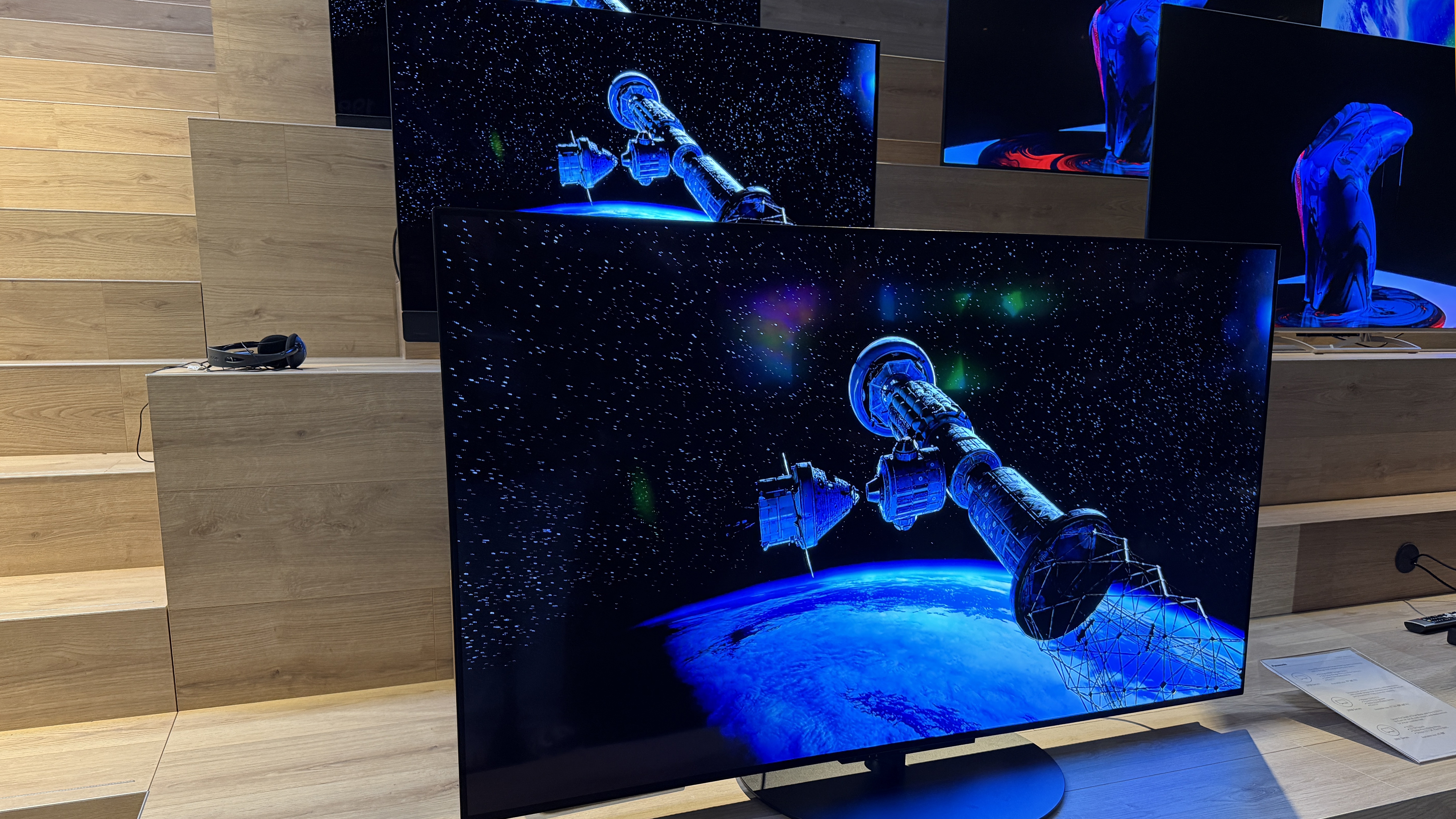 The Panasonic Z86C showing a space station and portion of the earth, with space behind it