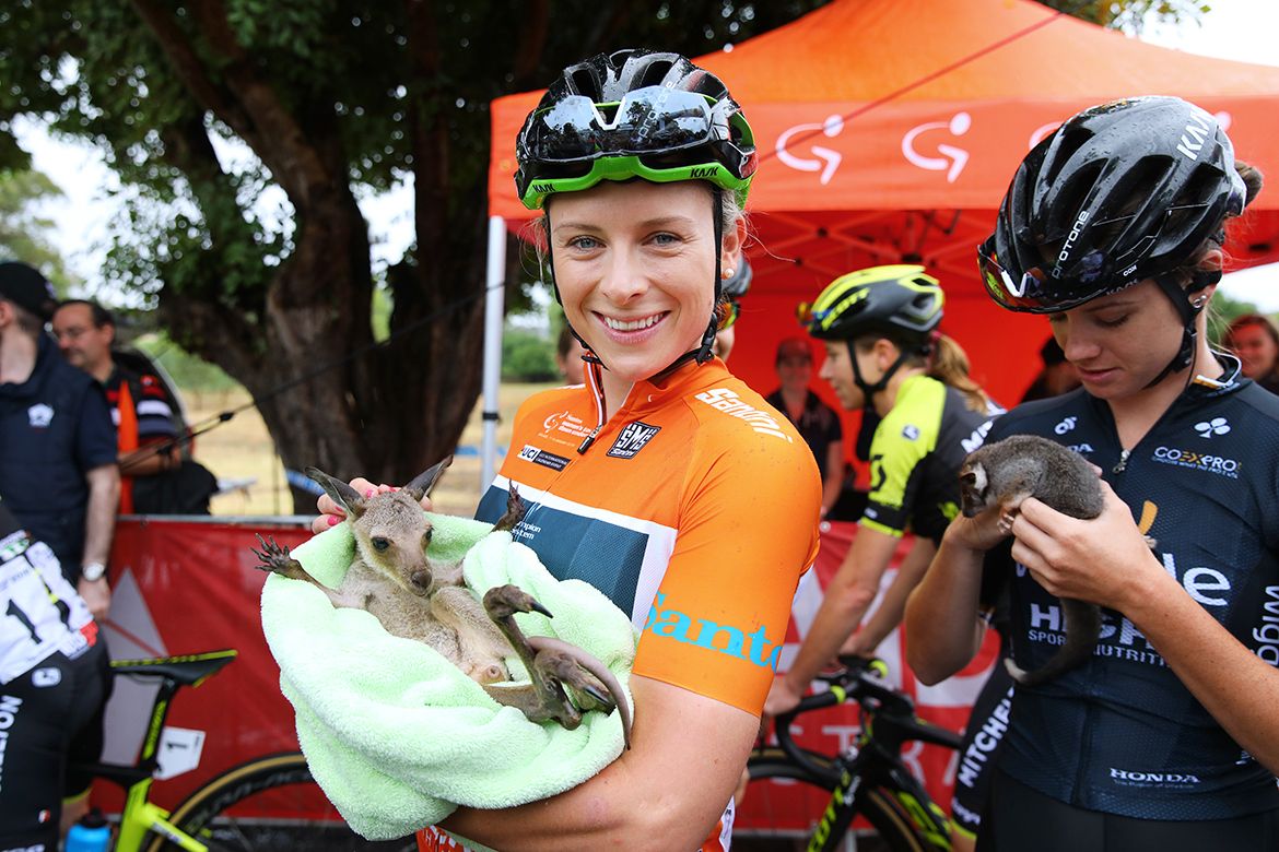 Race leader Annette Edmondson with a new friend at the sign on