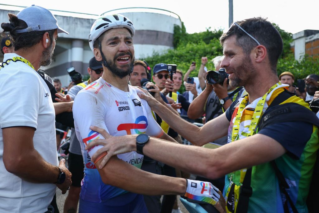 TotalEnergies team's French rider Anthony Turgis celebrates after winning the 9th stage of the 111th edition of the Tour de France cycling race, 199km stage departing and finishing in Troyes, on July 7, 2024. (Photo by MOLLY DARLINGTON / POOL / AFP)