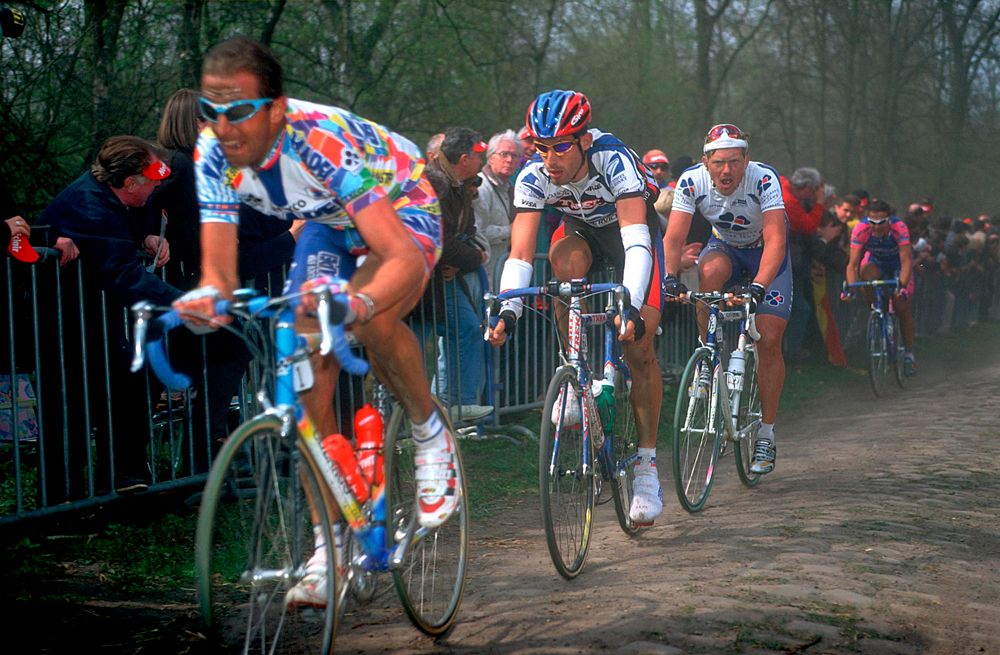 Andrea Tafi leads George Hincapie through the Arenberg Forest in 2000