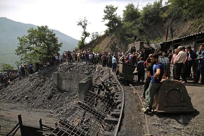 Miners and rescue workers at the mine that collapsed in Iran on Wednesday.