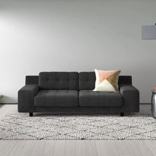 Dark grey modular sofa in white living room