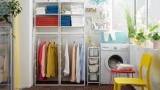 A laundry room shelving with towels and clothes on an Ikea JONAXEL storage unit