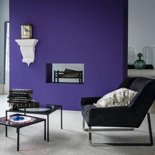 living room with purple feature wall