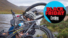 Bike with bags being carried through water