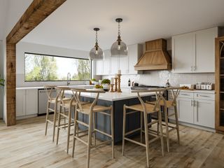 contemporary kitchen diner with wishbone stools around an island unit