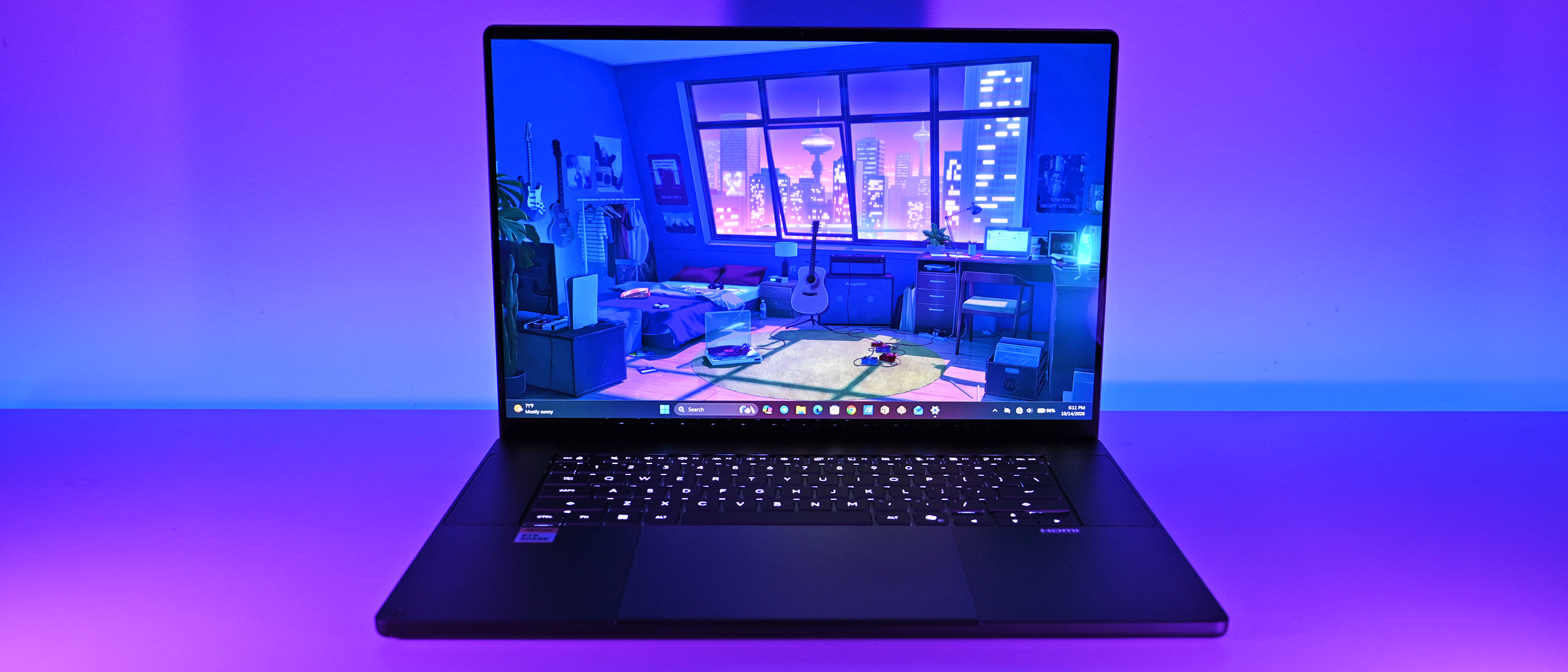 Front-facing view of the ASUS ProArt P16 laptop illuminated in purple studio light, showcasing the slim bezels, backlit keyboard, and glowing display.
