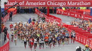 Wide shot of elite runners crossing the finish line at the Bank of America Chicago Marathon.