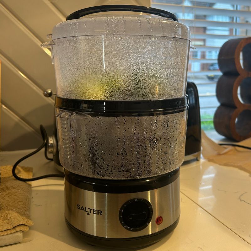 Salter 3 Tier Electric Food Steamer with two tiers, cooking rice and broccoli