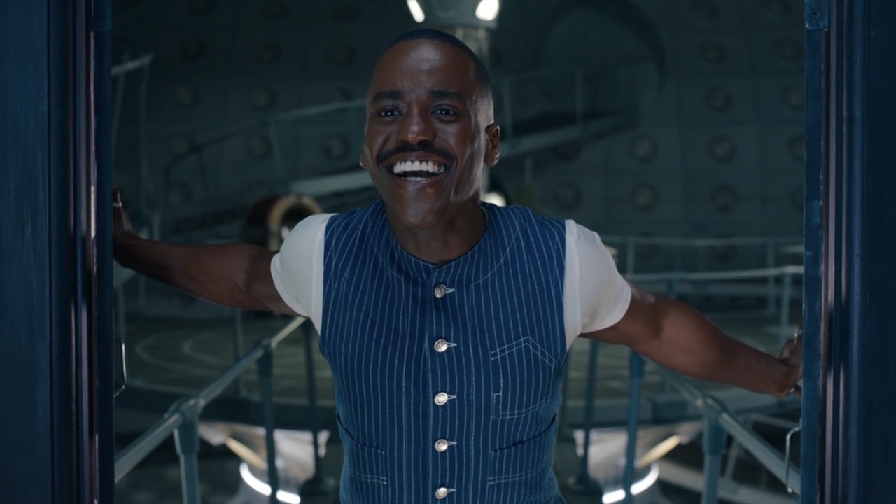 Fifteenth Doctor smiling while looking out at the Star of Bethlehem right before he regenerates