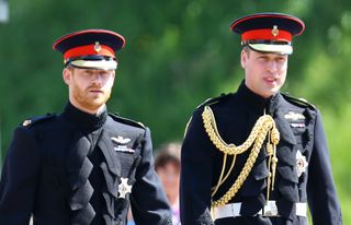 Prince Harry walks with his best man, Prince William, Duke of Cambridge as they arrive at St George's Chapel