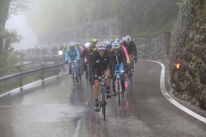 Omega Pharma Quick Step set the pace for Mark Cavendish as the rain continues to fall on stage 12