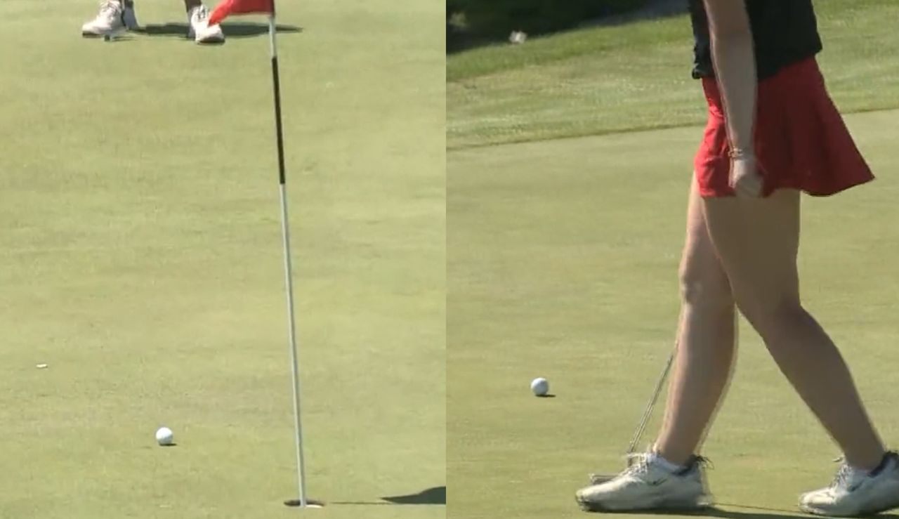 Players watch their golf ball run off the front of the green following a putt