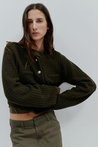 Dark green jumper with silver buttons