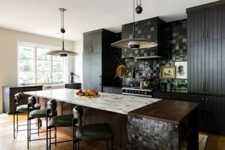 a kitchen with dark zellige tiles