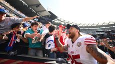 George Kittle of the San Francisco 49ers celebrates with fans after winning an NFL game against the Los Angeles Rams 