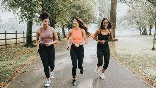 A group of women running through park