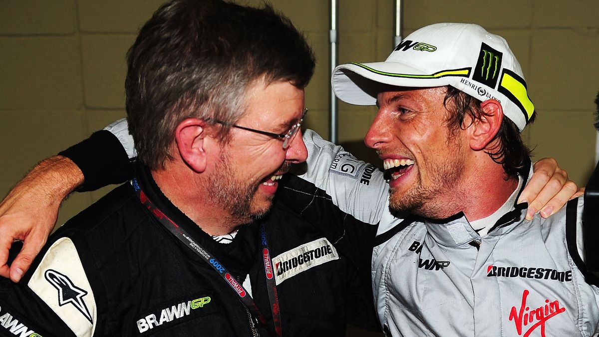 Jenson Button (R) of Great Britain and Brawn GP is congratulated by Brawn GP Team Principal Ross Brawn (L) after clinching the F1 World Drivers Championship during the Brazilian Formula One Grand Prix at the Interlagos Circuit on October 18, 2009 in Sao Paulo, Brazil.