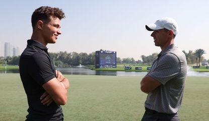 Lando Norris and Rory MciIlroy talk at the Dubai Desert Classic