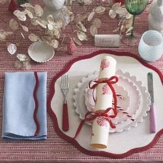 christmas place setting with cracker and napkin