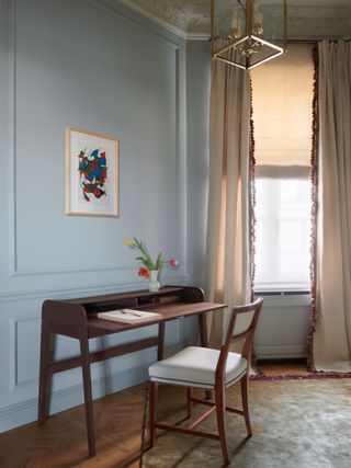 Blue room with curtains with fringing