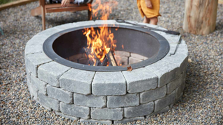 DIY grey brick fire pit with flame