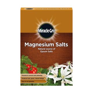 Brown box of Miracle-Gro magnesium salts with a picture of tomatoes and jasmine flowers on the front 