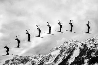 A composite image shows the parabolic path of a skier flying through the air.