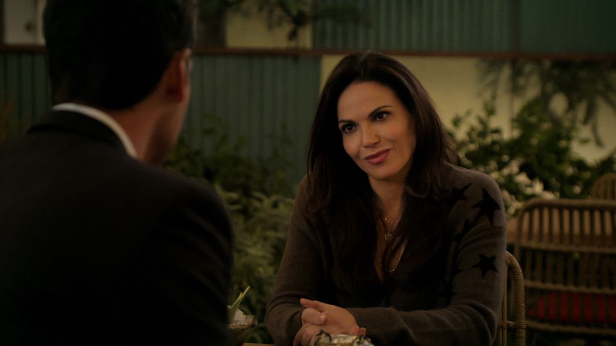 Manuel Garcia-Rulfo and Lana Parilla as Mickey and Lisa talking in The Lincoln Lawyer season 2