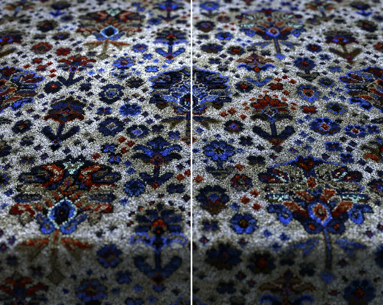 detail image of blue, brown and red patterned carpet