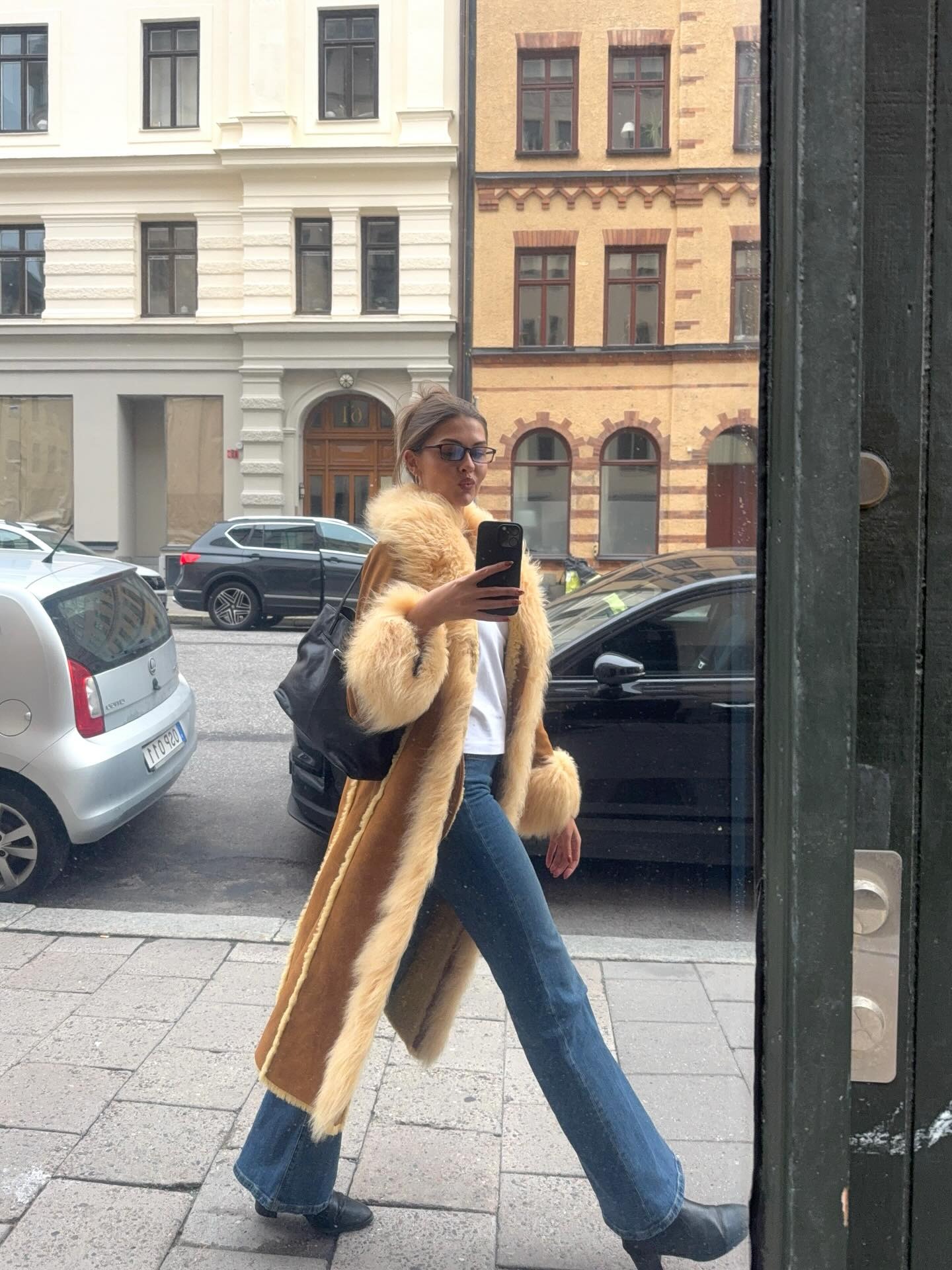 Fashion person Sofia Boman wears a winter jeans outfit 2025.