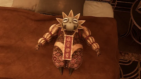 Esquie plush on a bed in Clair Obscur: Expedition 33