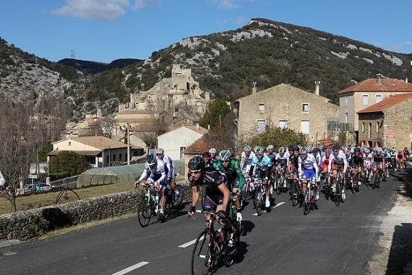 The peloton rolls out of Bourg-Saint-Andeol at the start of the race.