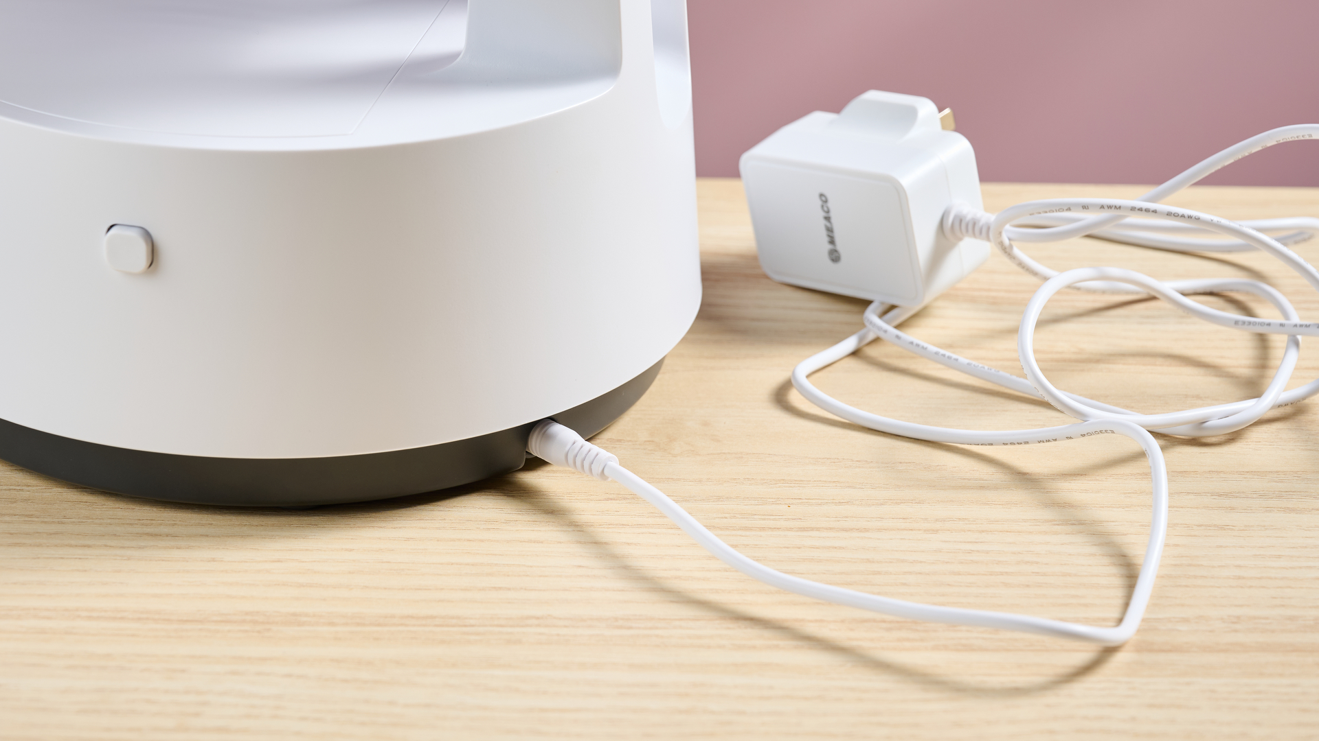 The 1.6m power cable is plugged into the back of the fan's base.