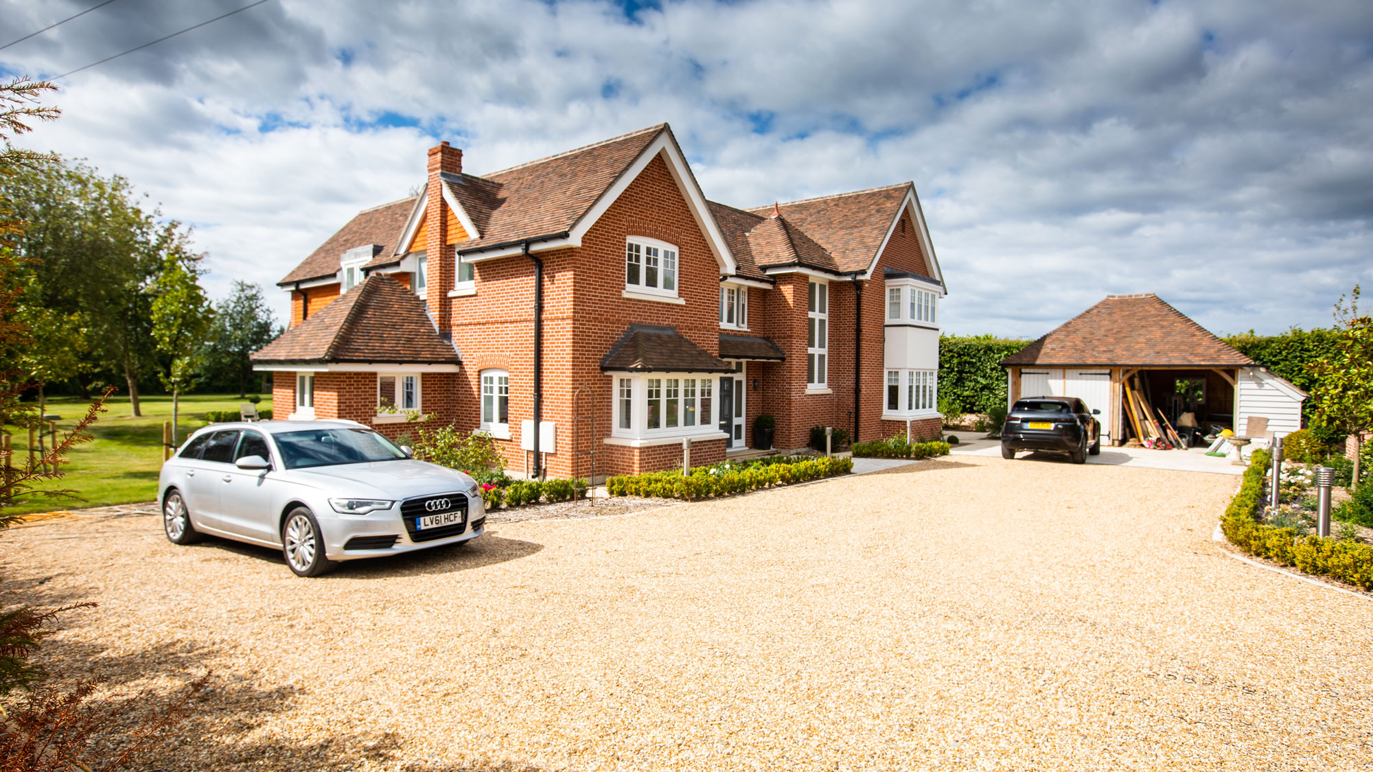 natural gravel driveway outside large new house