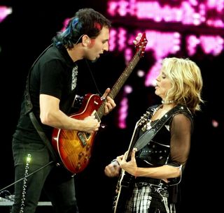Guitarist Monte Pittman (L) and Madonna perform during the first of two sold-out shows at the MGM Grand Garden Arena during her Drowned World Tour September 1, 2001 in Las Vegas, Nevada.