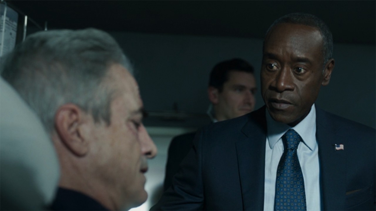 Scene from the Marvel TV show Secret Invasion. Here we see a still from Secret Invasion season 1 episode 6 - -Fake Rhodey talks to the POTUS.