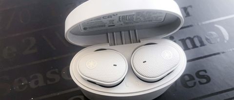 Review hero image of Yamaha TW-E5B earbuds in white in charging case