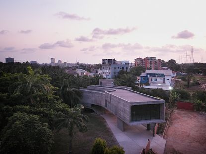 Large concrete structure in amongst trees